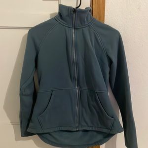 This is a Navy blue zip up sweater it is so comfy and cute.